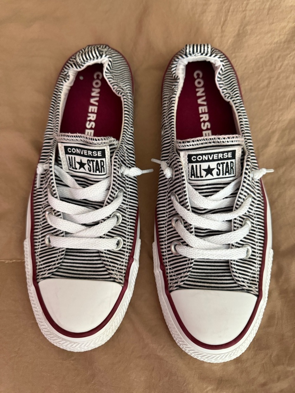 Converse Women’s Black & White Striped Slip-On Sneakers with Burgundy Accents